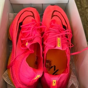 Men’s Nike air zoom pink orange shoes.